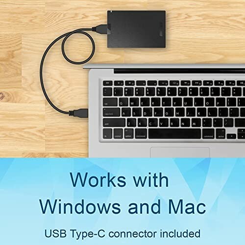 External hard drive connected to a laptop with USB Type-C.