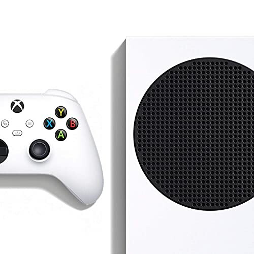 White gaming console and controller with black vent.